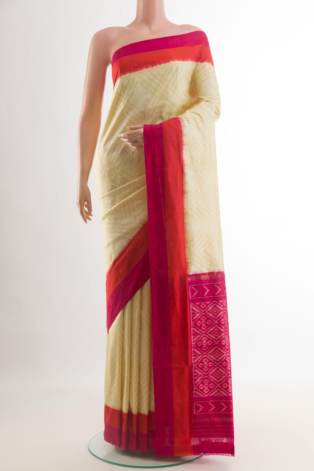 Cream Pochampally Silk Saree with Pure Ikat on the body and Plain Border.  displayed on a mannequin