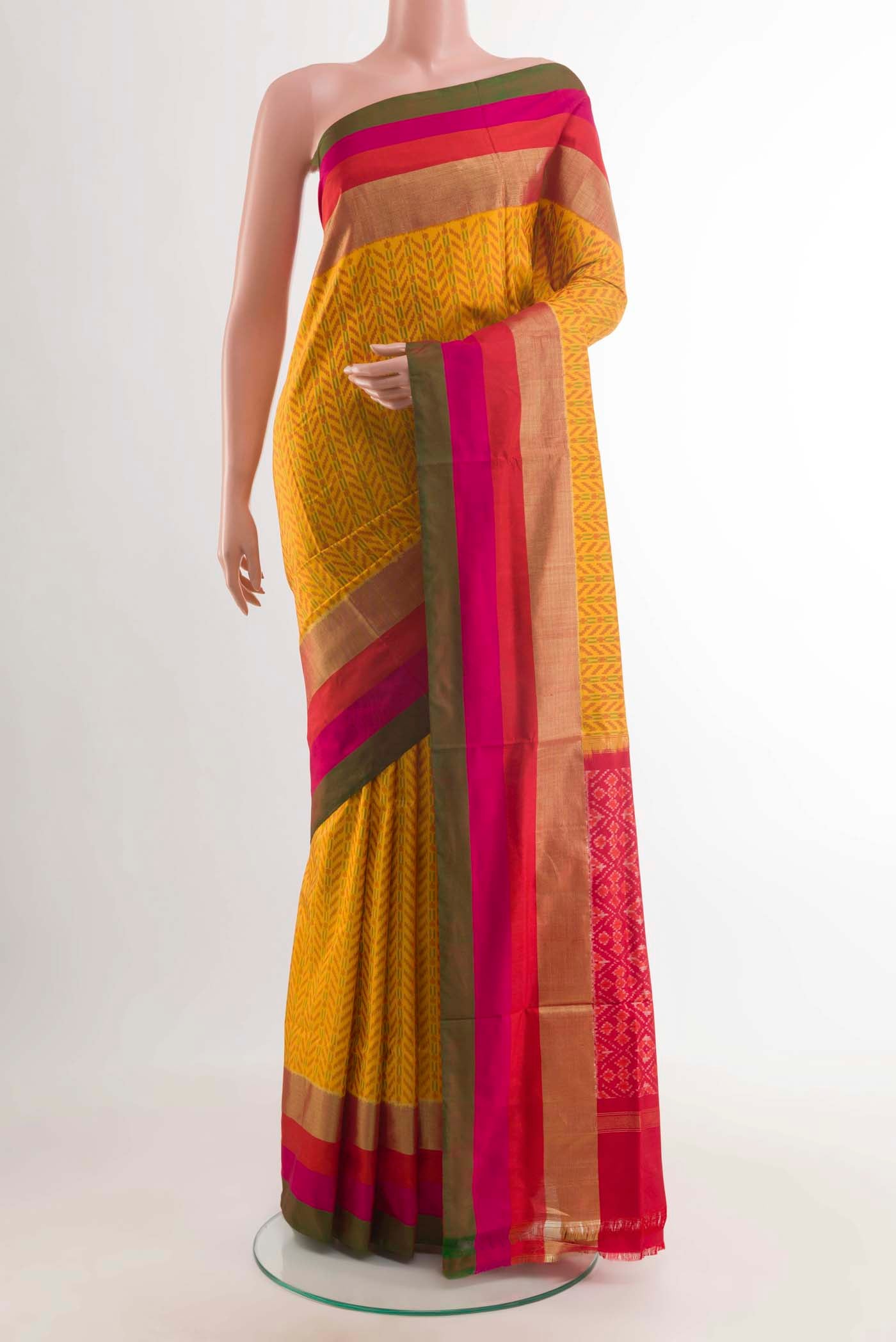 Mustard Pochampally Silk Saree with Pure Ikat on the body and Zari Border displayed on a mannequin