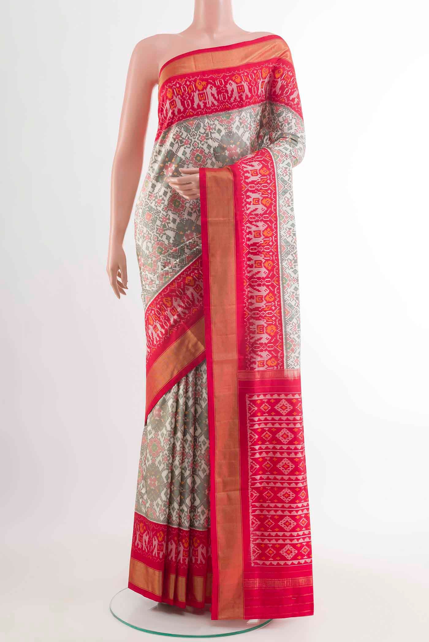 Off White Pochampally Silk Saree with Pure Ikat on the body and Zari Border displayed on a mannequin