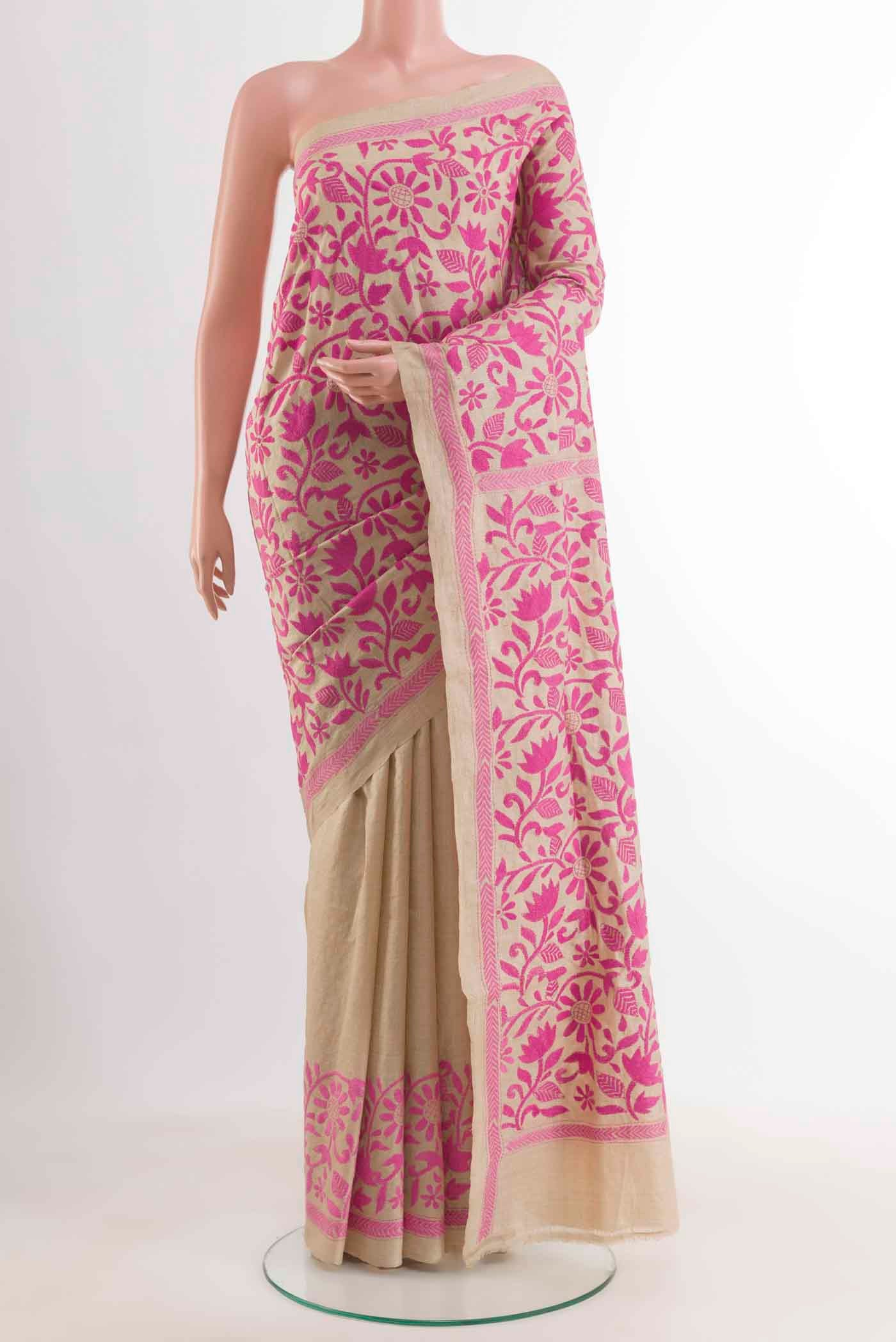 Beige Tussar Saree with Kantha Work on the body and Embroidery Border displayed on a mannequin