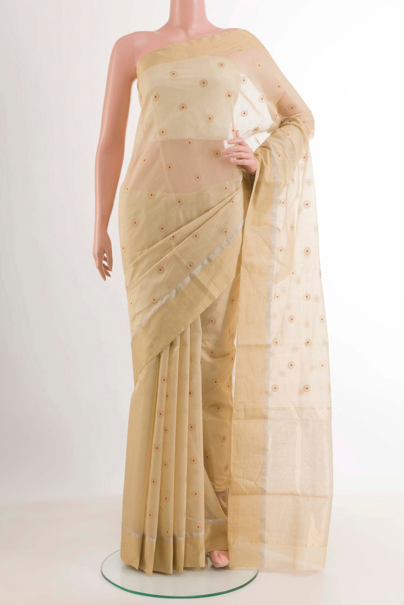 Off White Chanderi Silk Saree with Zari Butta on the body and Zari Border.  displayed on a mannequin