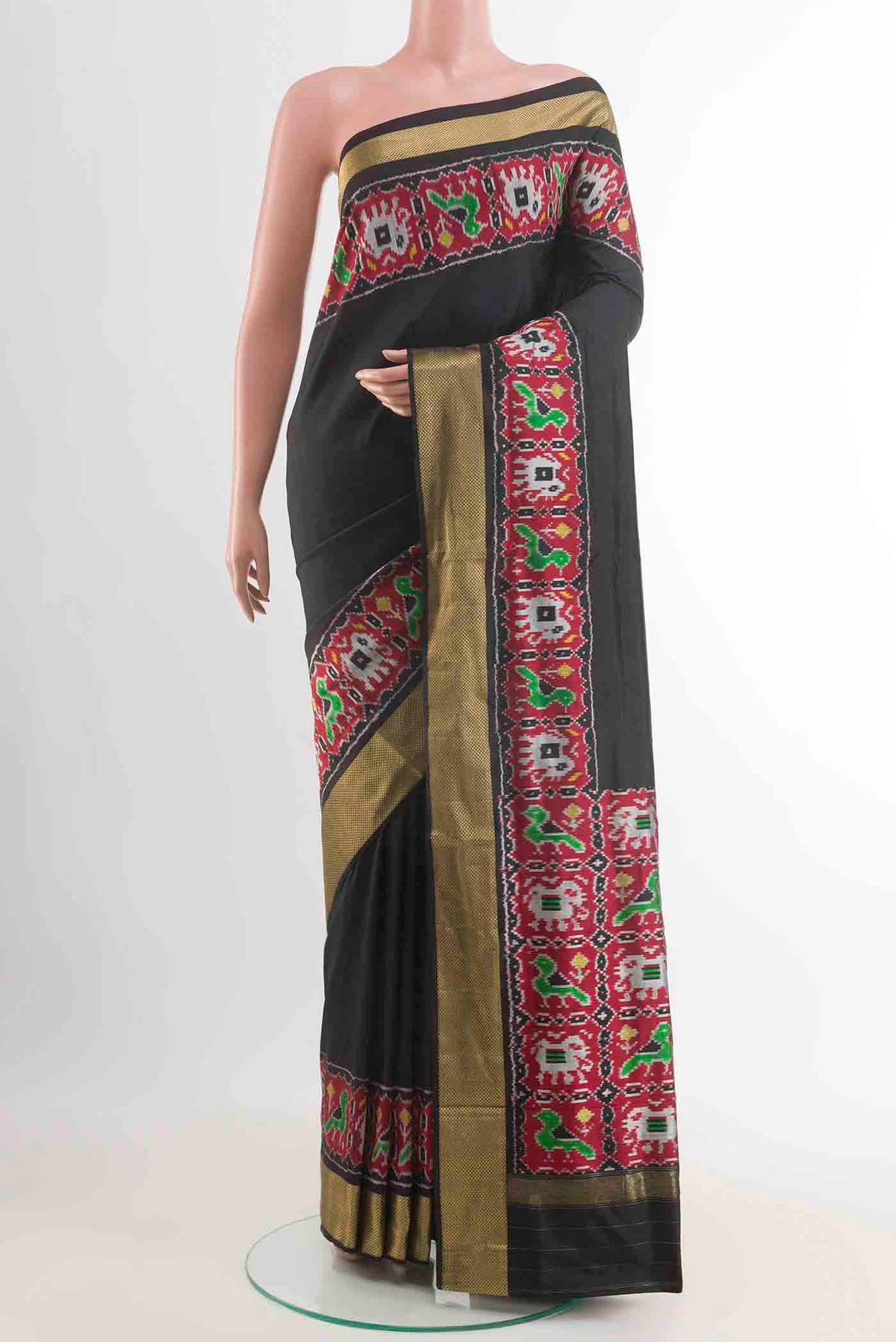 Black Pochampally Silk Saree with Plain Body and Zari Border displayed on a mannequin