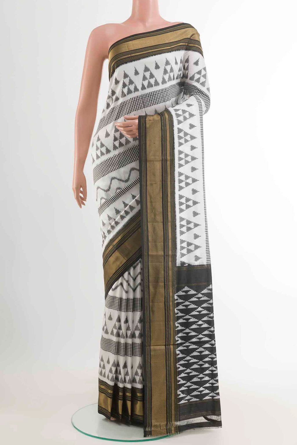 Off White Pochampally Silk Saree with Pure Ikat on the body and Zari Border displayed on a mannequin