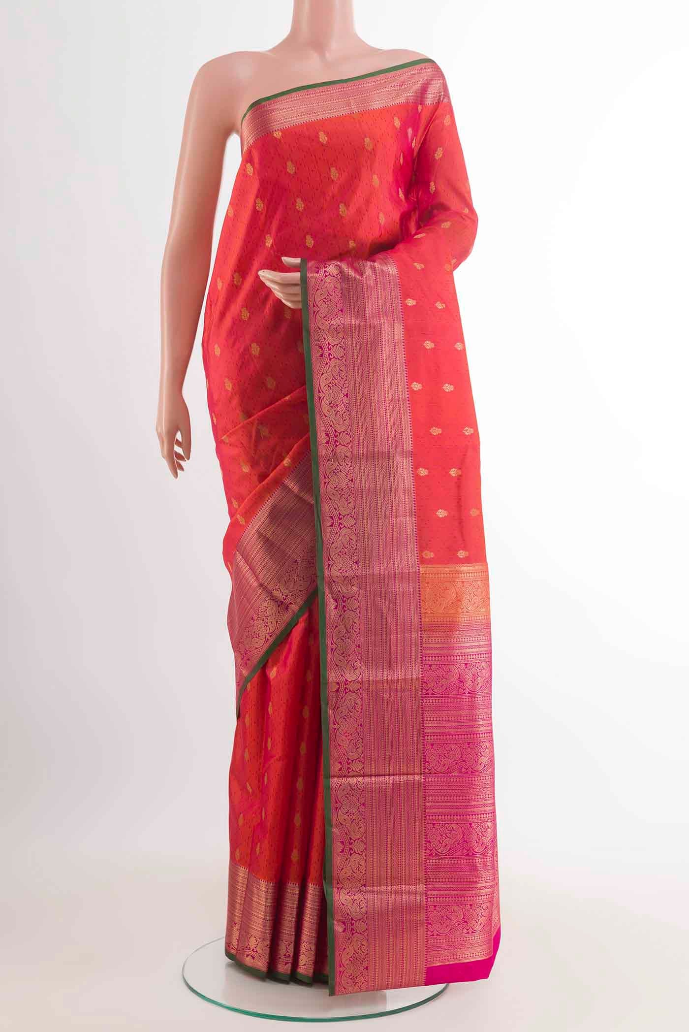 Orange with Pink Color Kanchipuram Silk Saree with Jacquard With Zari Butta on the body and Zari Border displayed on a mannequin