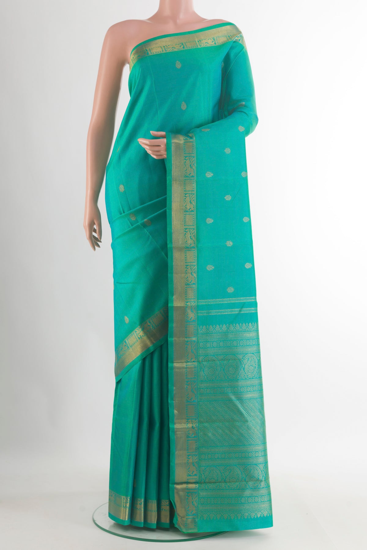 Pure Silk Pure Zari Sea Green Kanchipuram Saree with Zari Butta on the body and Zari Border.  displayed on a mannequin