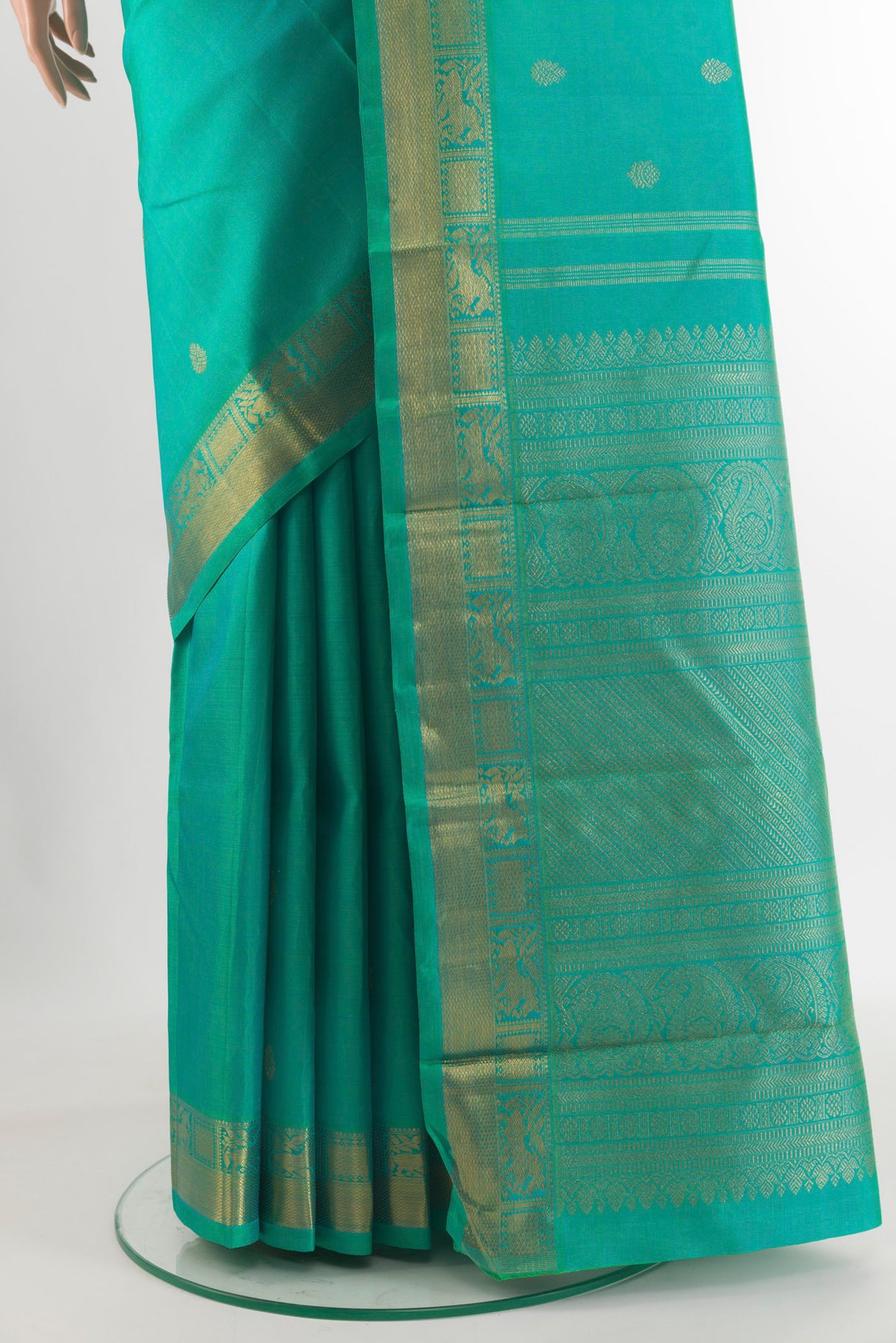Pleats and pallu of Pure Silk Pure Zari Sea Green Kanchipuram Saree with Zari Butta on the body and Zari Border. 