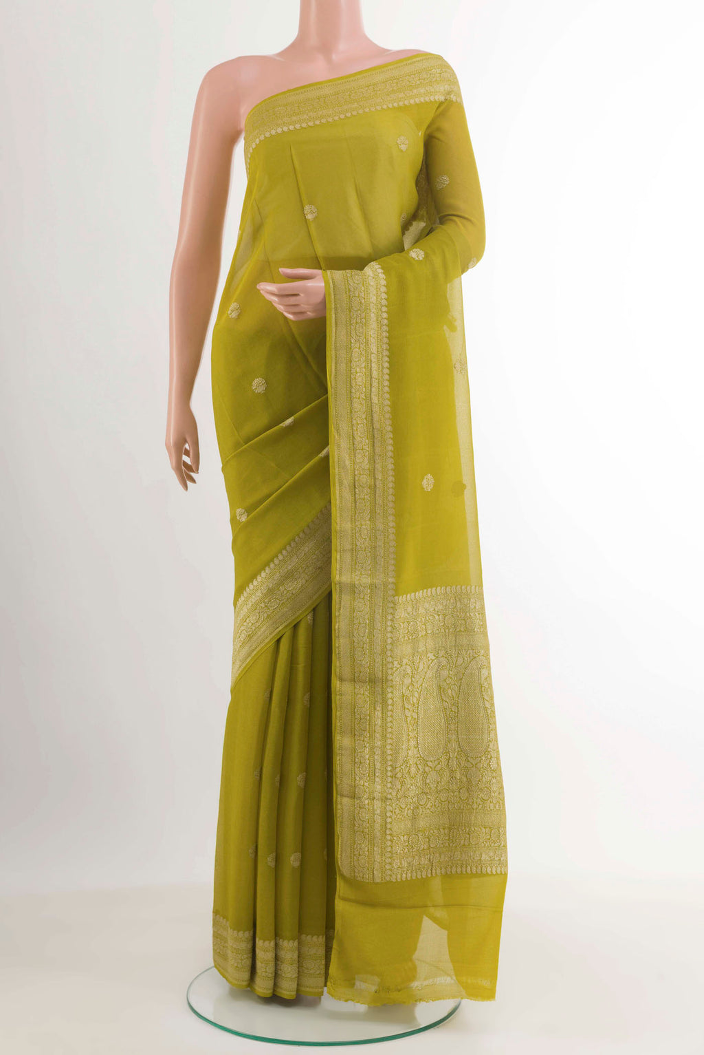 Lemon Yellow Crepe Saree with Zari Butta on the body and Zari Border.  displayed on a mannequin