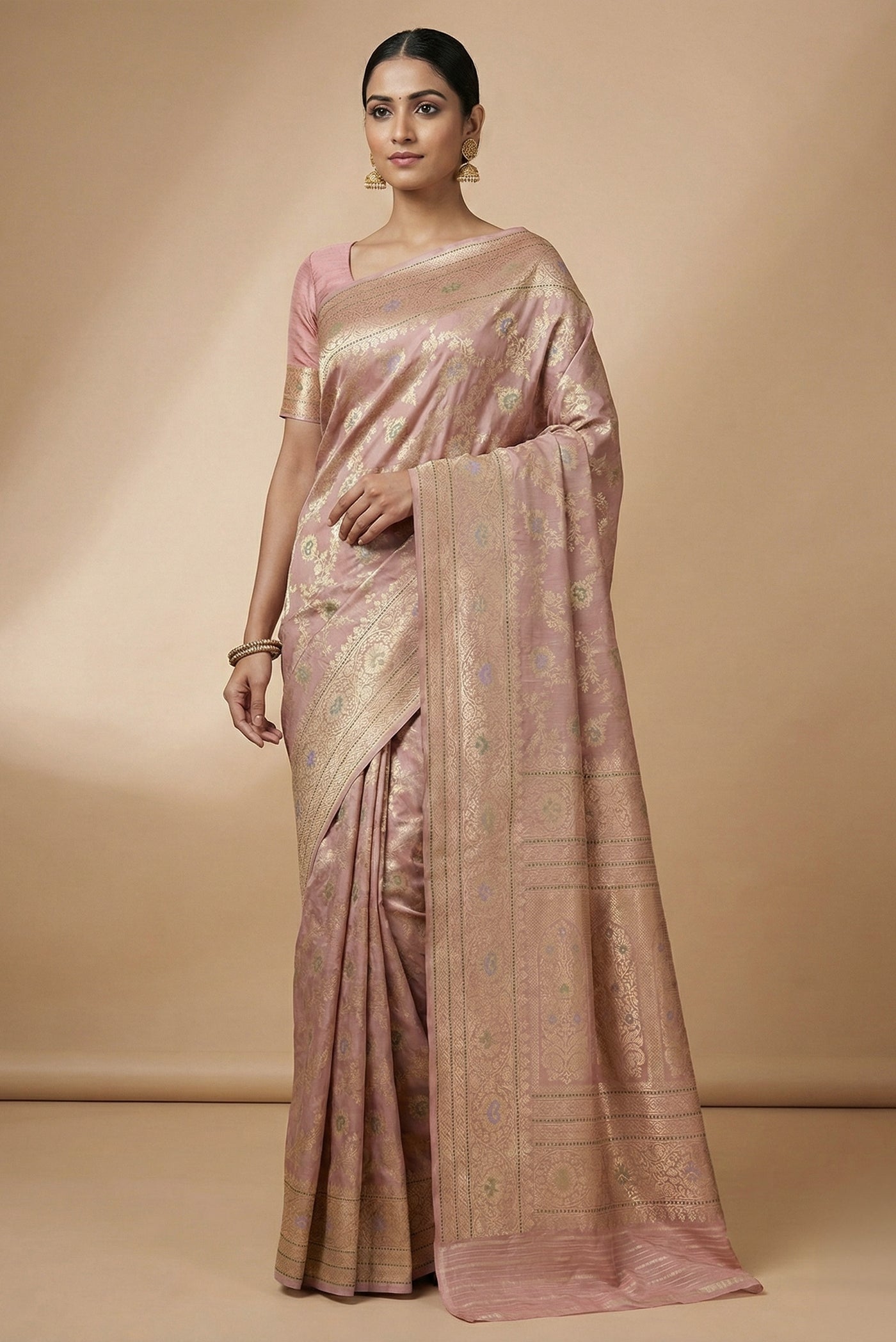 Model wearing a Rose Gold Banarasi Silk Saree with Zari Brocade on the body and Zari Border