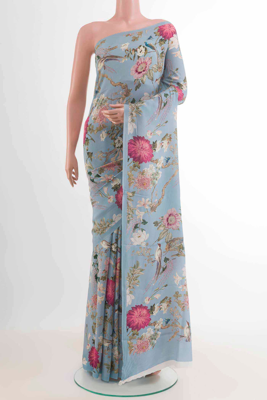 Blue Mysore Crepe Saree with Floral Print on the body and Without Border displayed on a mannequin