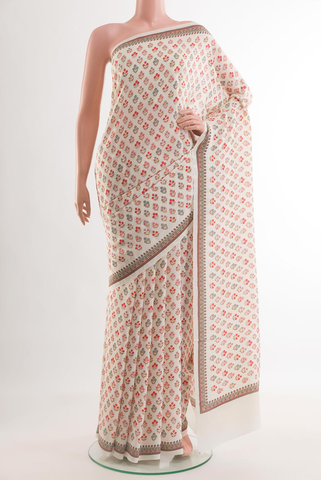 Off White Mysore Crepe Saree with Printed design on the body and Printed Border.  displayed on a mannequin