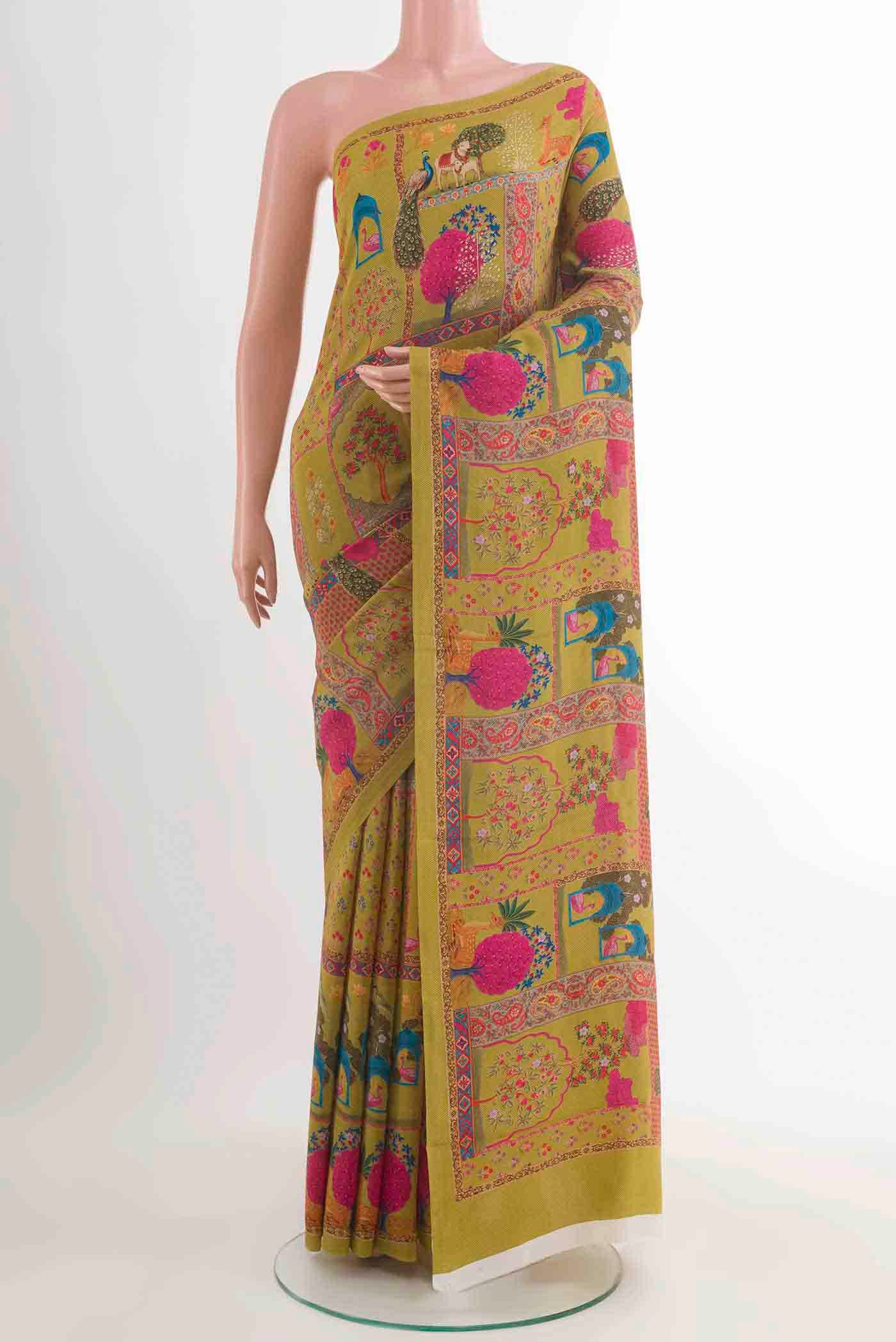 Mehandi Green Mysore Crepe Saree with Printed design on the body and Plain Border displayed on a mannequin