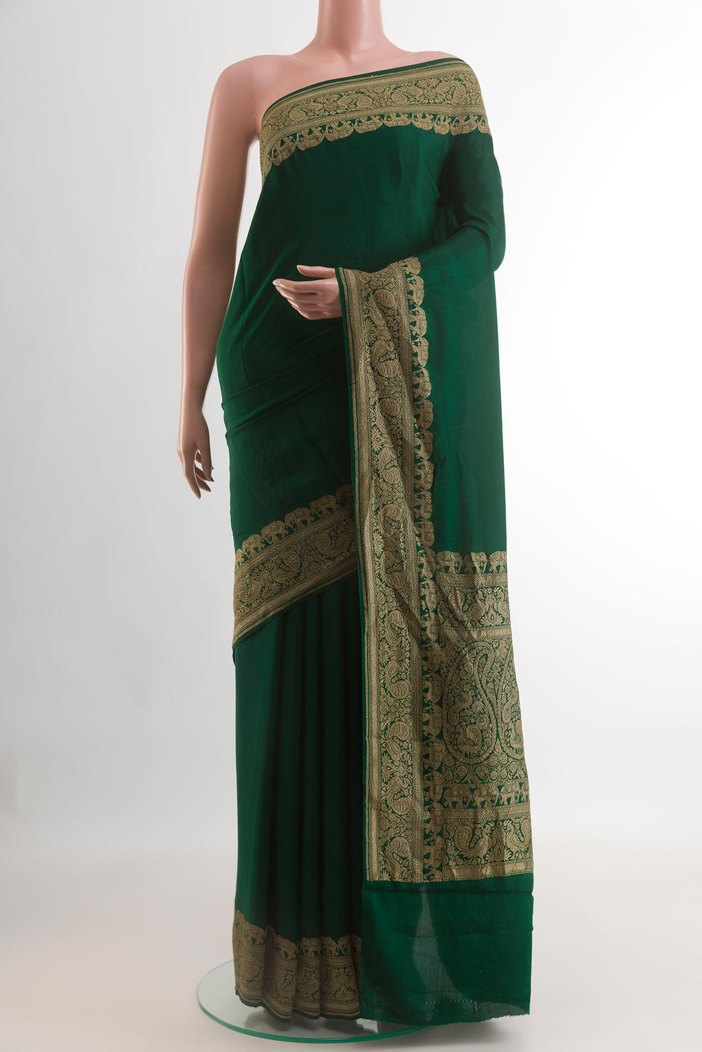 Green Crepe Saree with Plain Body and Zari Border.  displayed on a mannequin