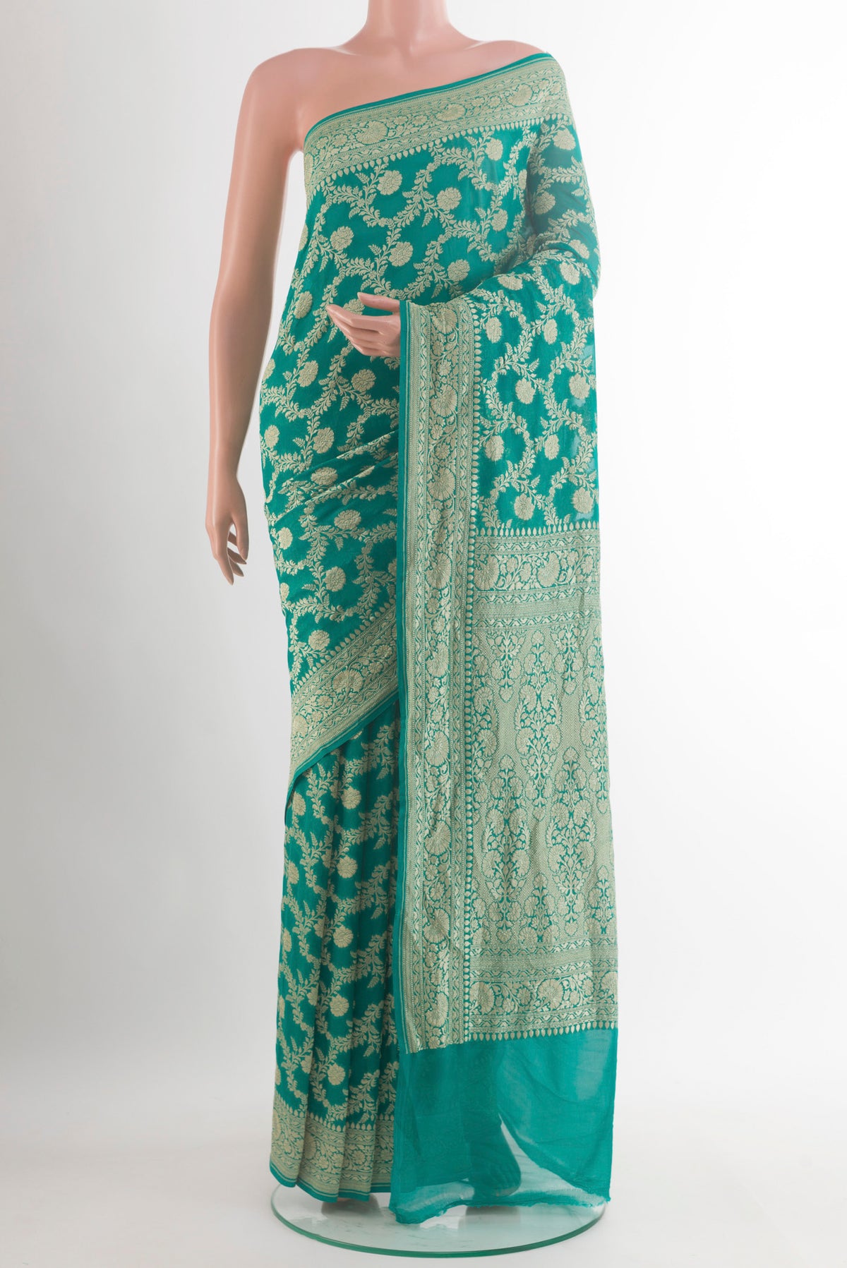 Sea Green Banarasi Georgette Saree with Zari Brocade on the body and Zari Border.  displayed on a mannequin