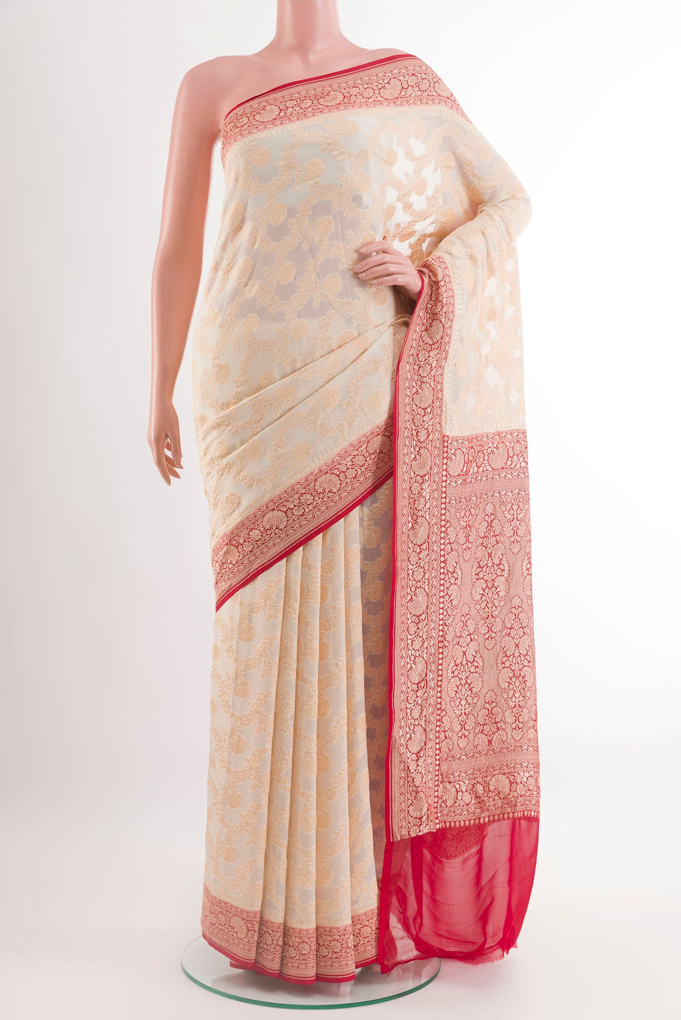 Off White Banarasi Georgette Saree with Zari Brocade on the body and Zari Border.  displayed on a mannequin