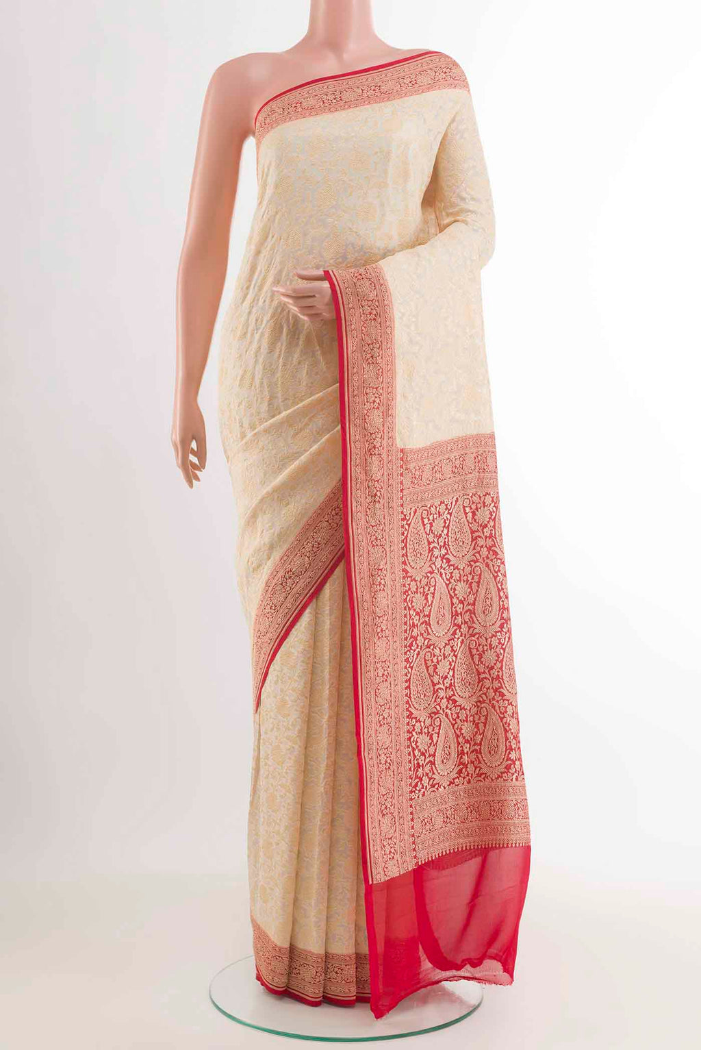 Off White Banarasi Georgette Saree with Zari Brocade on the body and Zari Border displayed on a mannequin