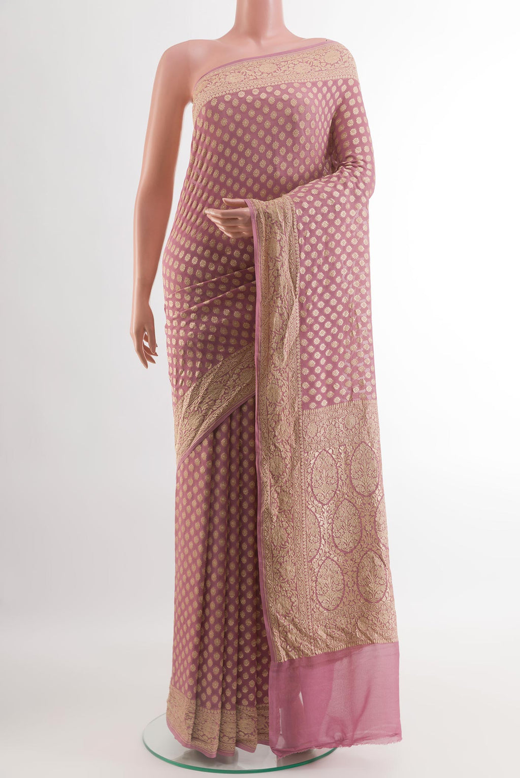Lavender Banarasi Georgette Saree with Zari Butta on the body and Zari Border.  displayed on a mannequin
