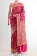 Pink Banarasi Georgette Saree with Zari Brocade on the body and Plain Border displayed on a mannequin