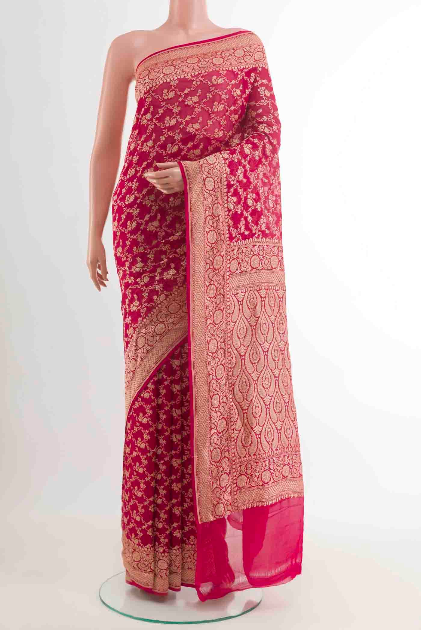 Pink Banarasi Georgette Saree with Zari Brocade on the body and Plain Border displayed on a mannequin