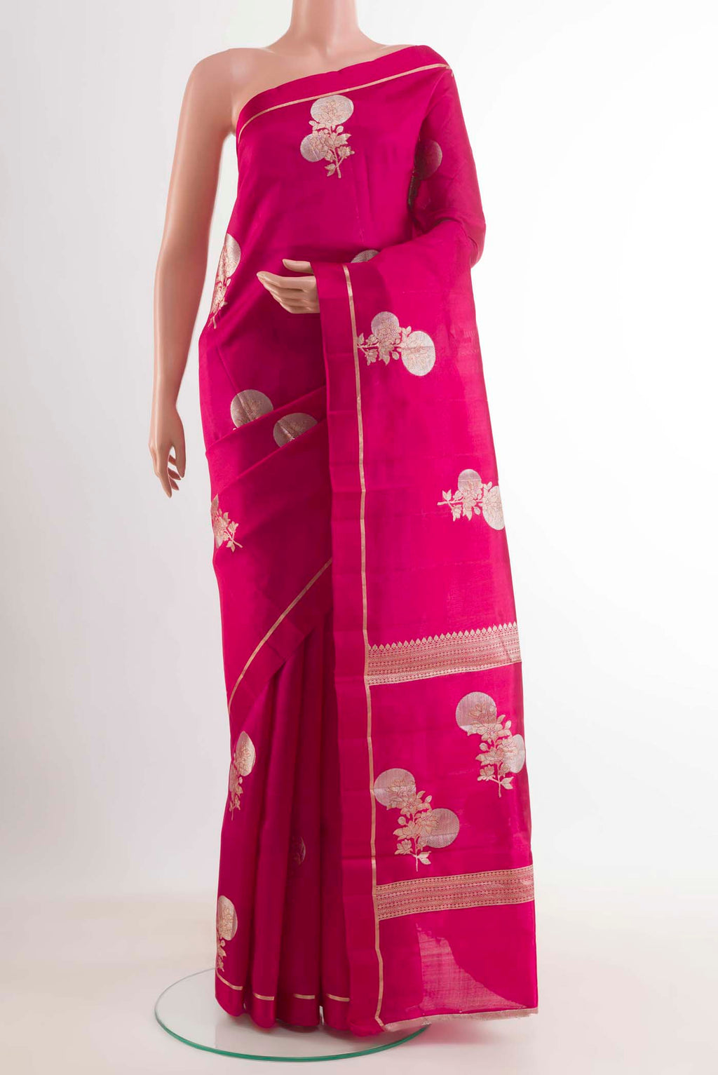 Rani Pink Banarasi Raw Silk Saree with Zari Butta on the body and Thin Zari Line displayed on a mannequin
