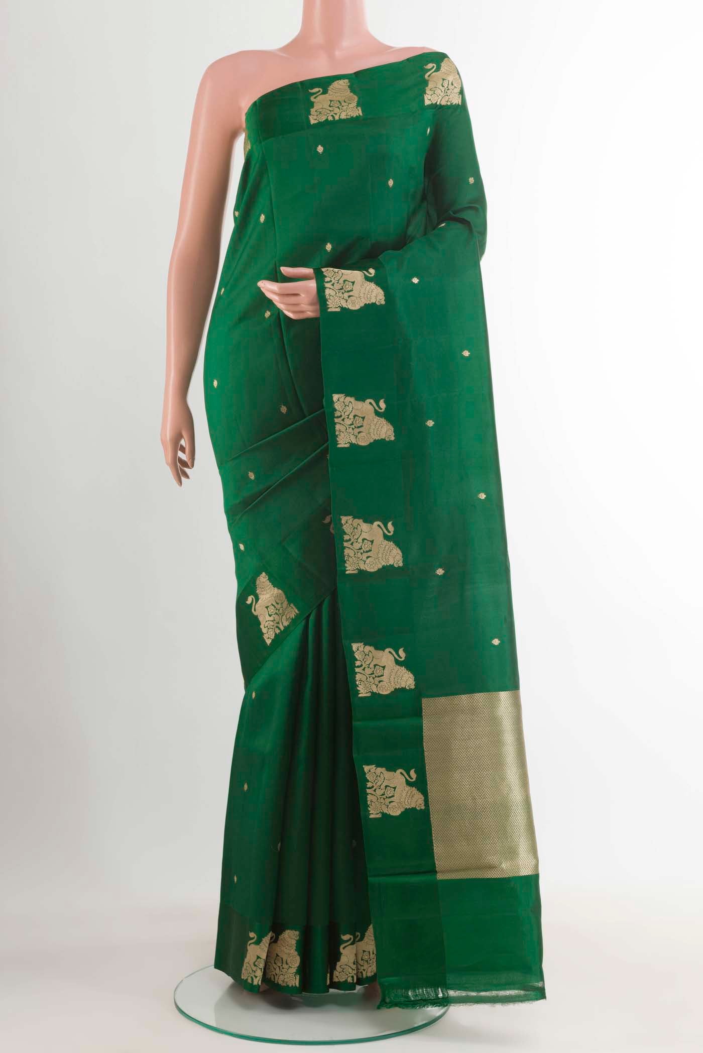 Bottle Green Banarasi Katan Silk Saree with Zari Butta on the body and Satin Border displayed on a mannequin