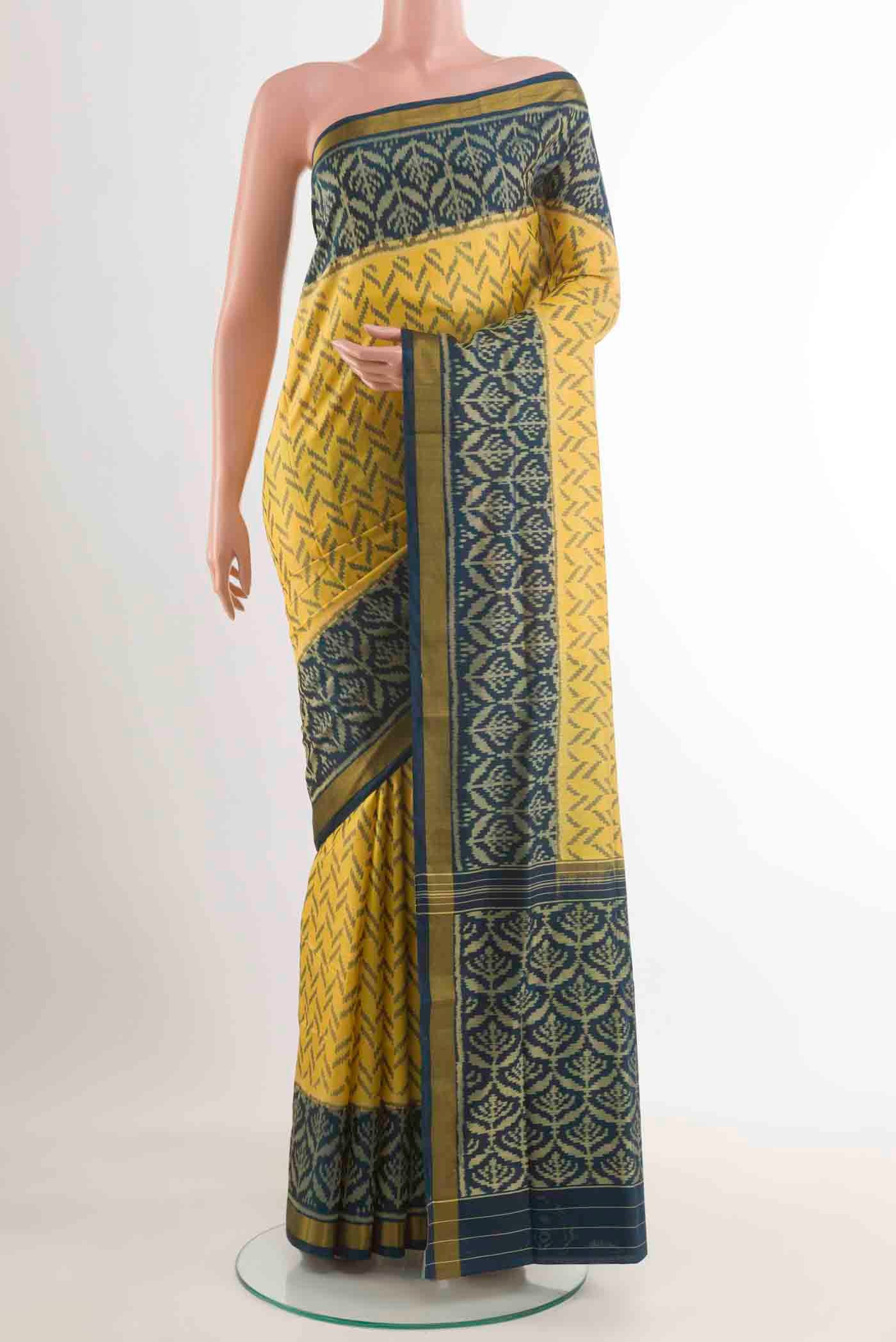 Yellow Rajkot Patola Silk Saree with Pure Ikat on the body and Zari Border displayed on a mannequin