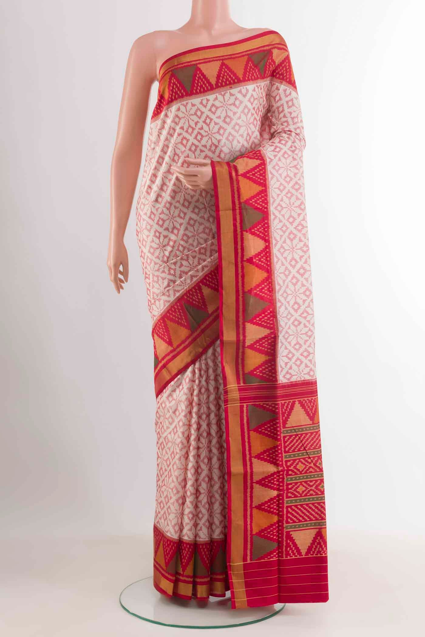 Off White Rajkot Patola Silk Saree with Ikat design on the body and Zari Border displayed on a mannequin
