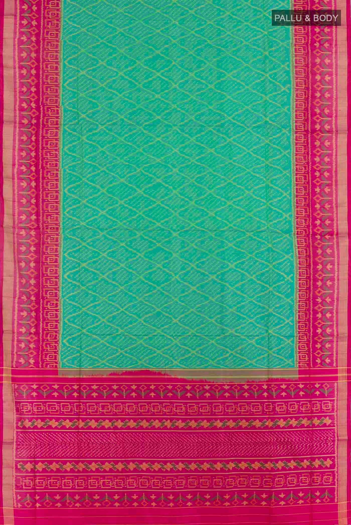 Flat view of Green Rajkot Patola Silk Saree with Ikat design on the body and Zari Border