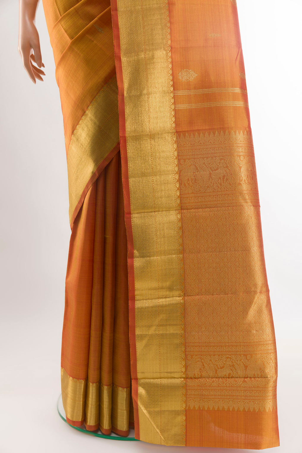 Pleats and pallu of Peach Kanjivaram Silk Saree with Zari Brocade on the body and Zari Border. 