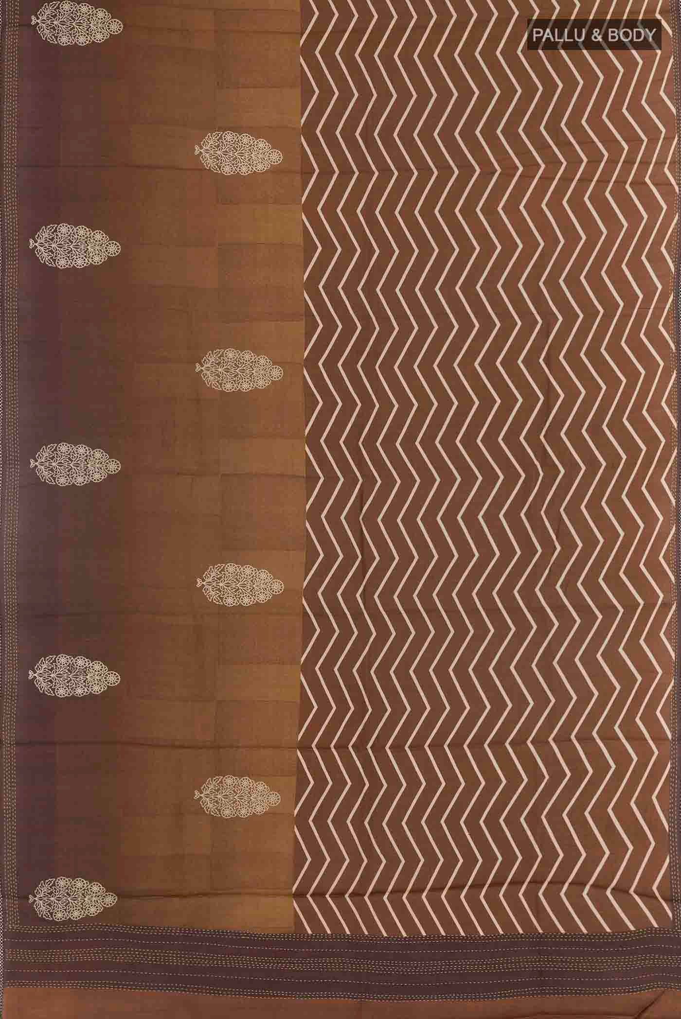 Flat view of Brown Tussar Silk Saree with Zig Zag design on the body and Embroidery Border
