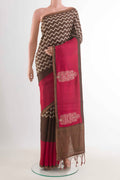 Brown Tussar Silk Saree with Zig Zag design on the body and Zari Border displayed on a mannequin