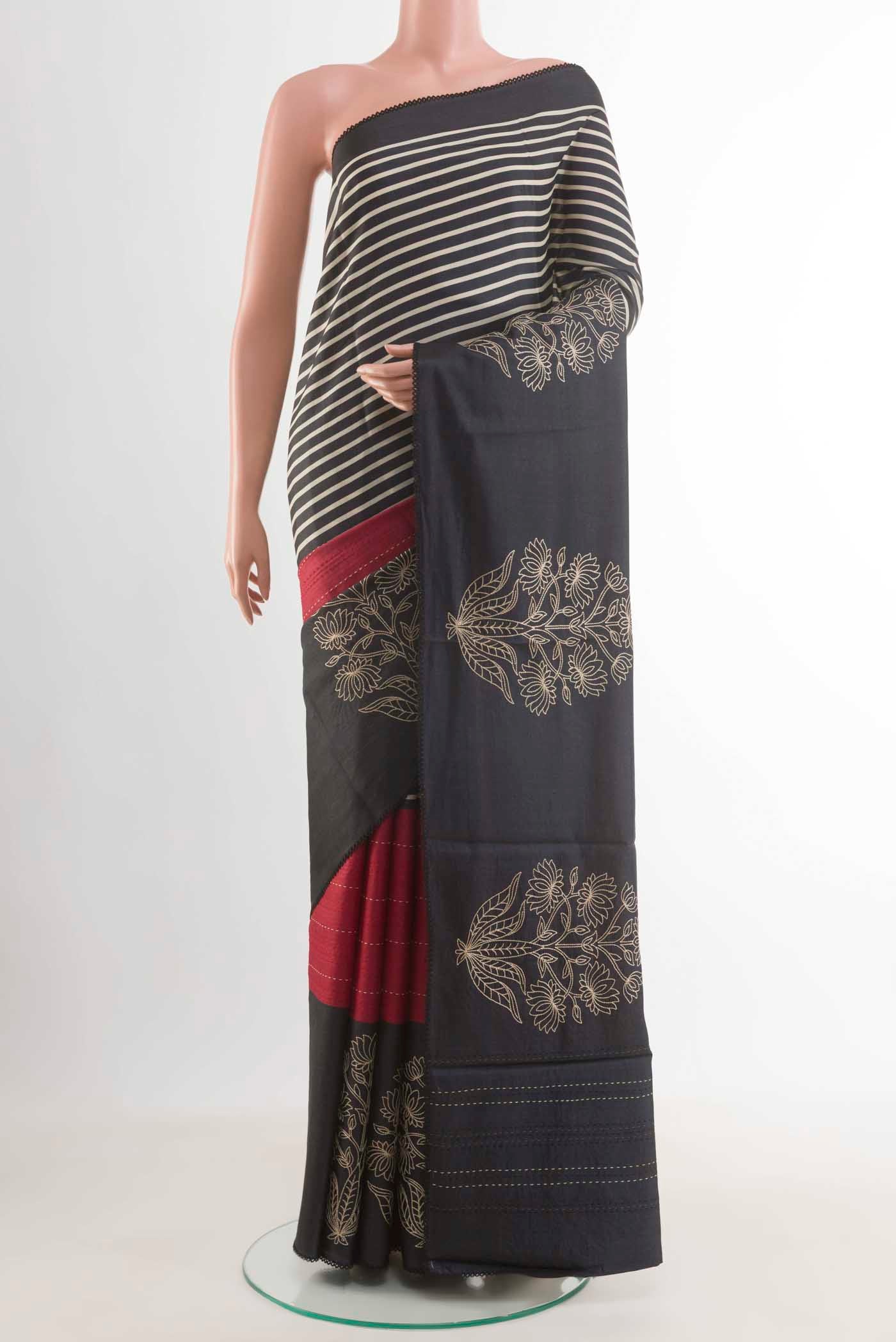 Red Tussar Saree with Half And Half on the body and Zari Border displayed on a mannequin