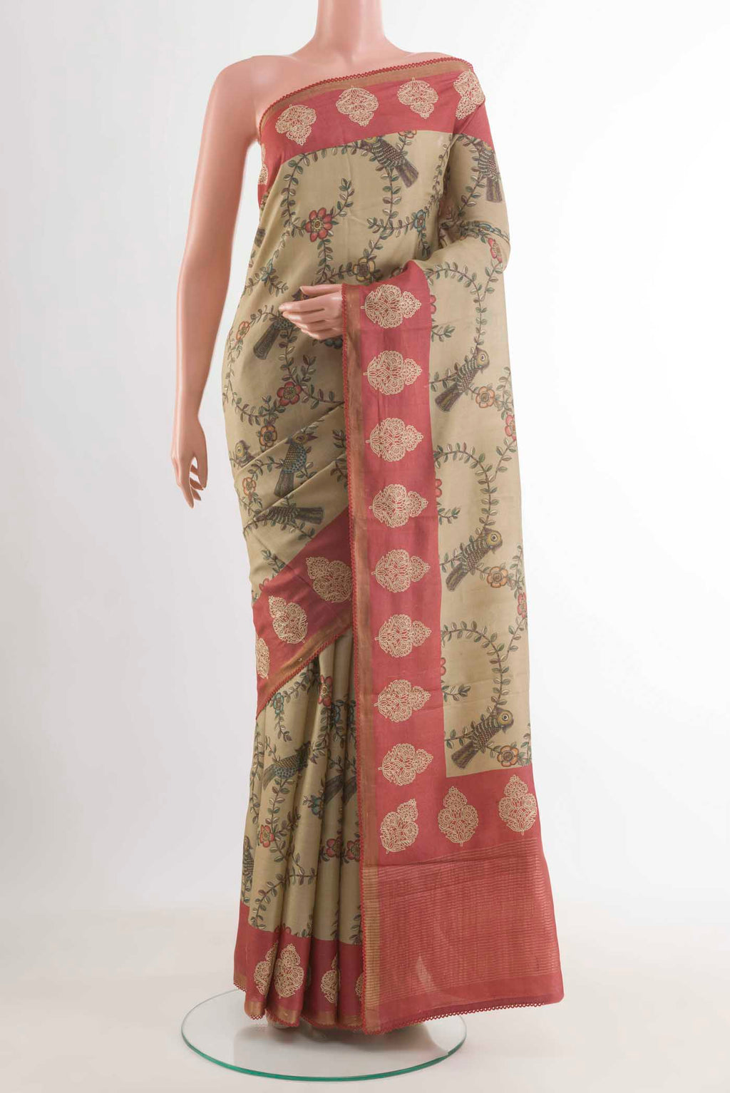 Beige Tussar Silk Saree with Printed design on the body and Embroidery Border displayed on a mannequin