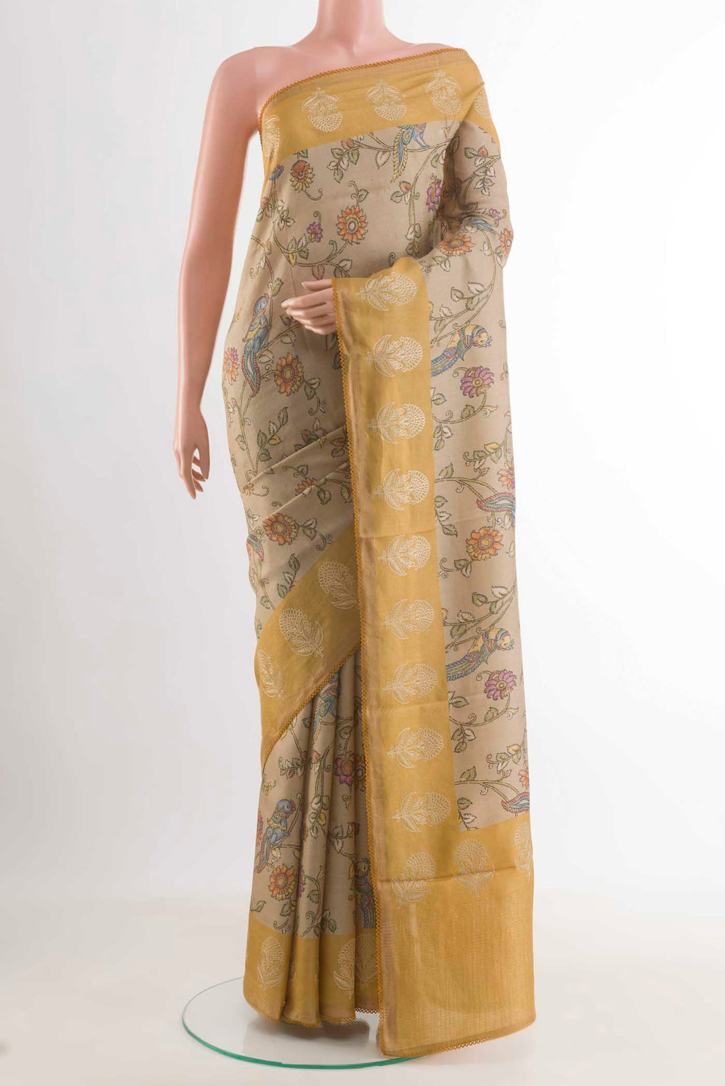 Beige Tussar Silk Saree with Printed design on the body and Embroidery Border displayed on a mannequin
