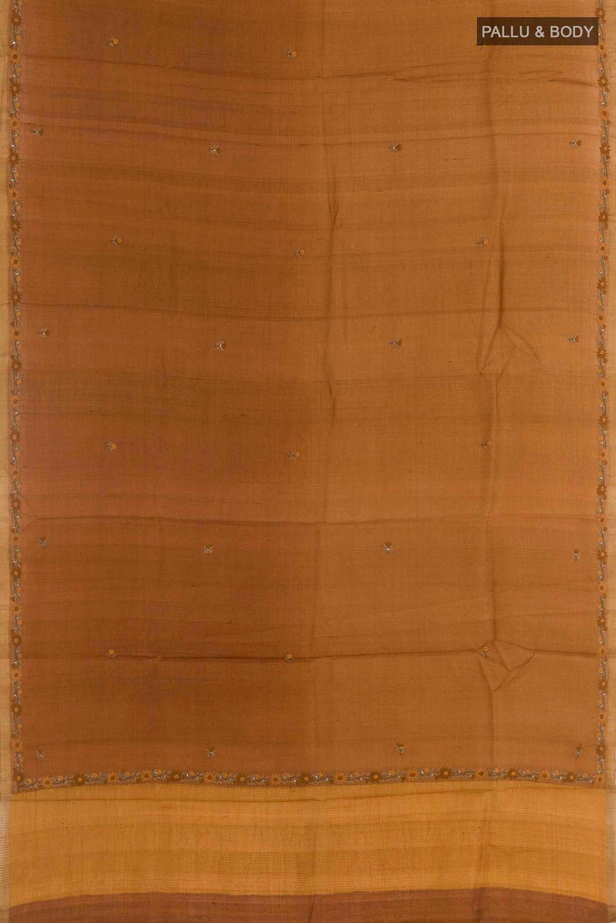 Flat view of Brown Tussar Silk Saree with Embroidery on the body and Embroidery Border
