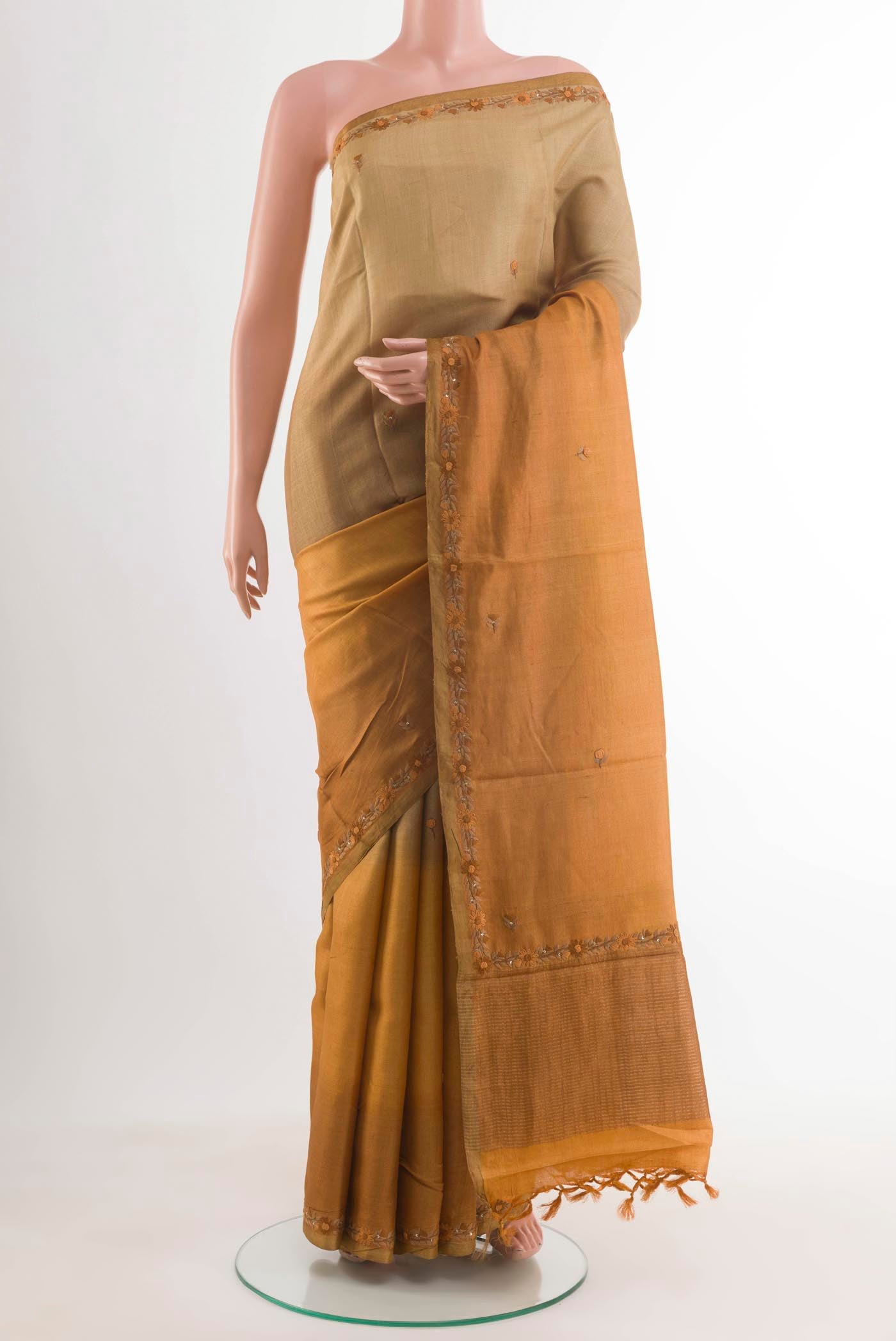 Multi Color Tussar Silk Saree with Embroidery on the body and Embroidery Border displayed on a mannequin