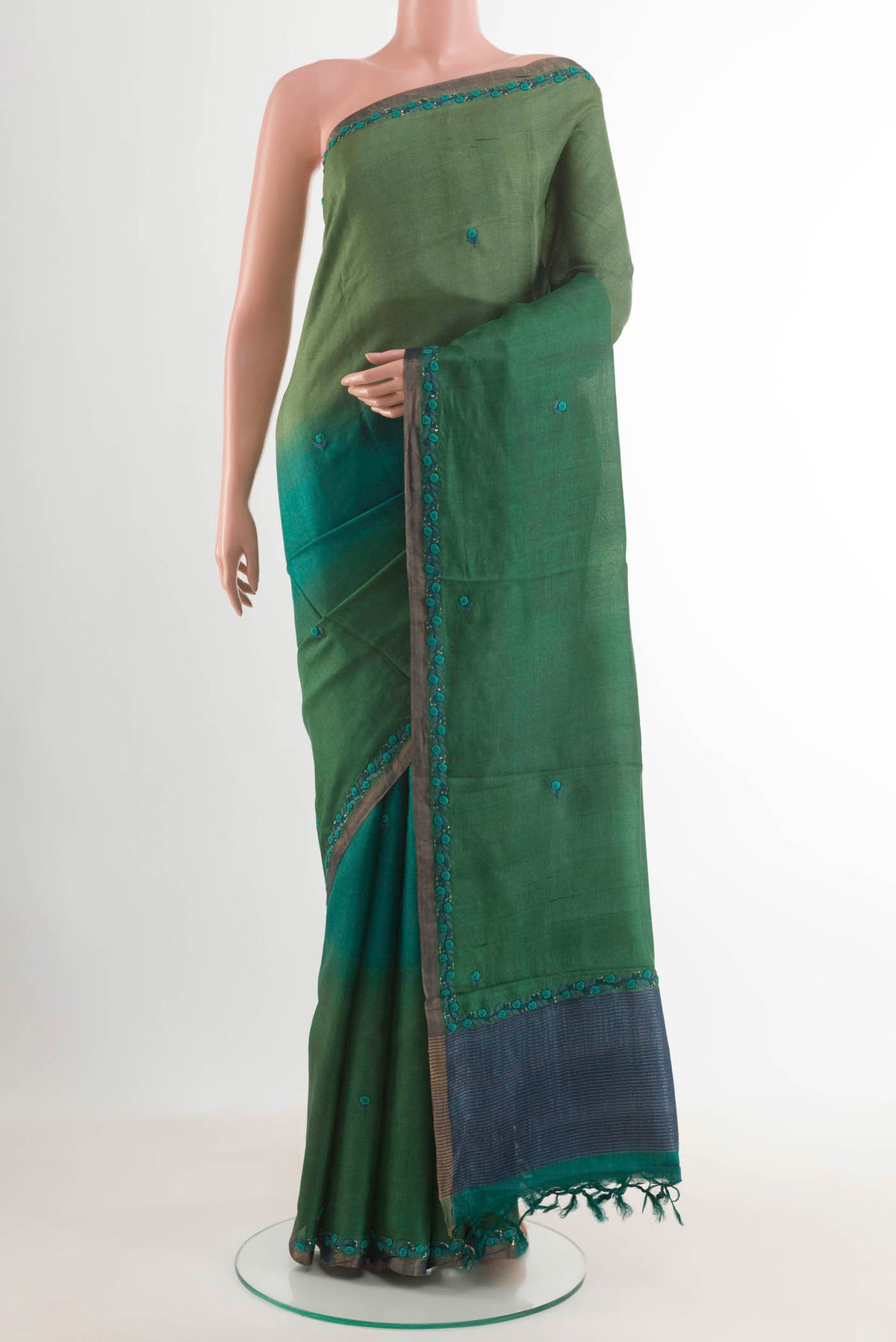 Multi Color Tussar Silk Saree with Embroidery on the body and Zari Border displayed on a mannequin