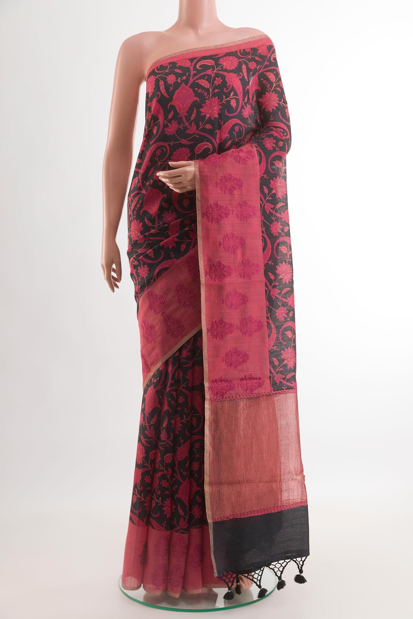 Black Tussar Silk Saree with Printed design on the body and Zari Border.  displayed on a mannequin