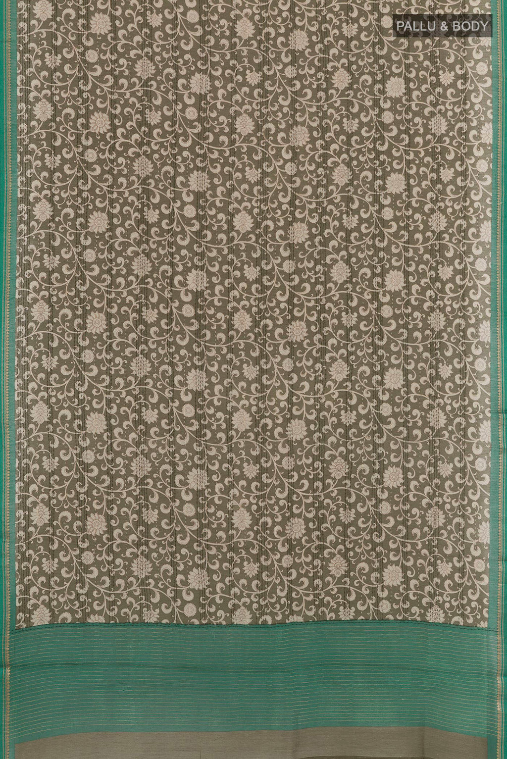 Flat view of Mehandi Green Tussar Saree with Printed design on the body and Zari Border. 