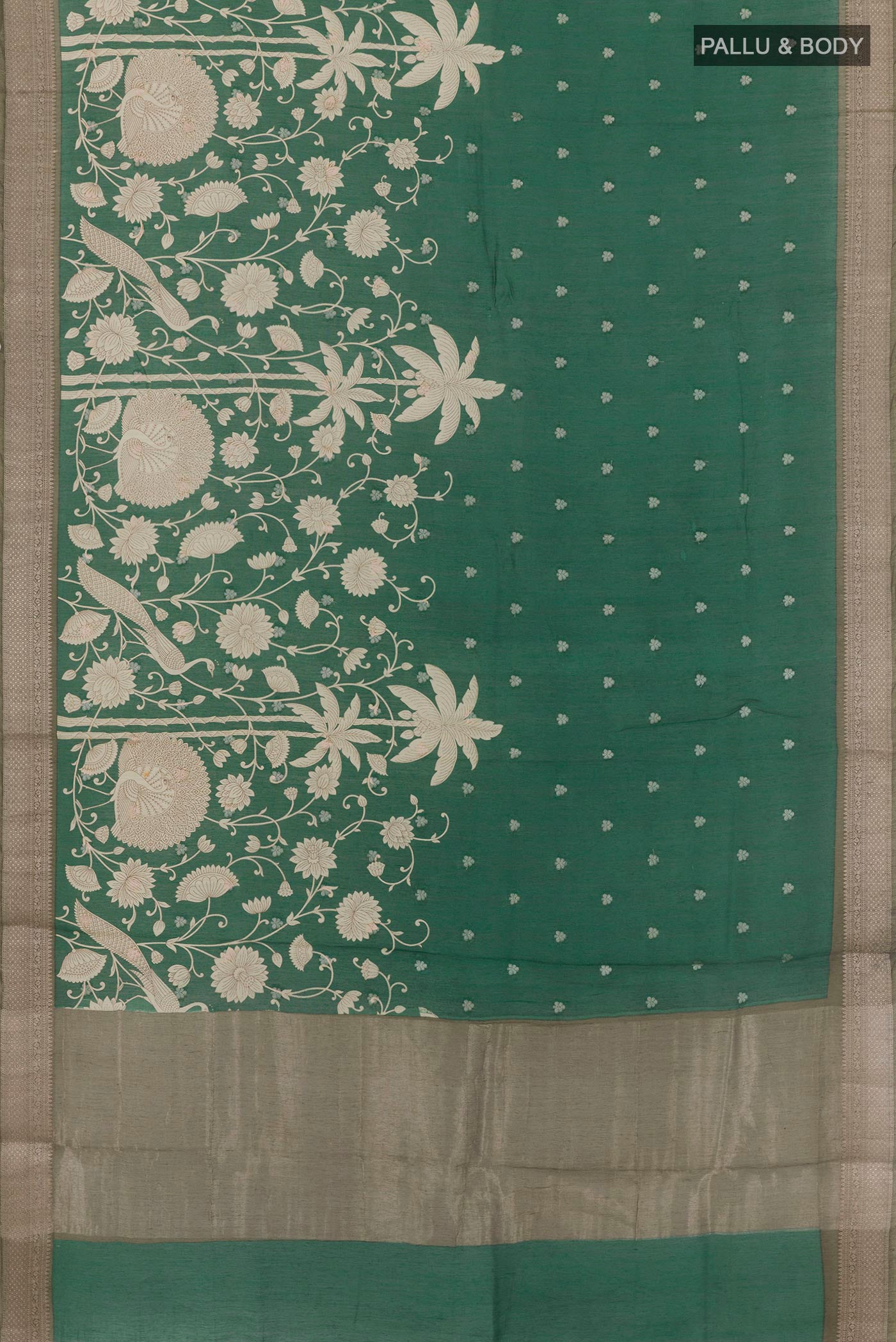 Flat view of Green Tussar Saree with Printed design on the body and Zari Border. 