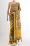 Beige Tussar Saree with Printed design on the body and Zari Border displayed on a mannequin