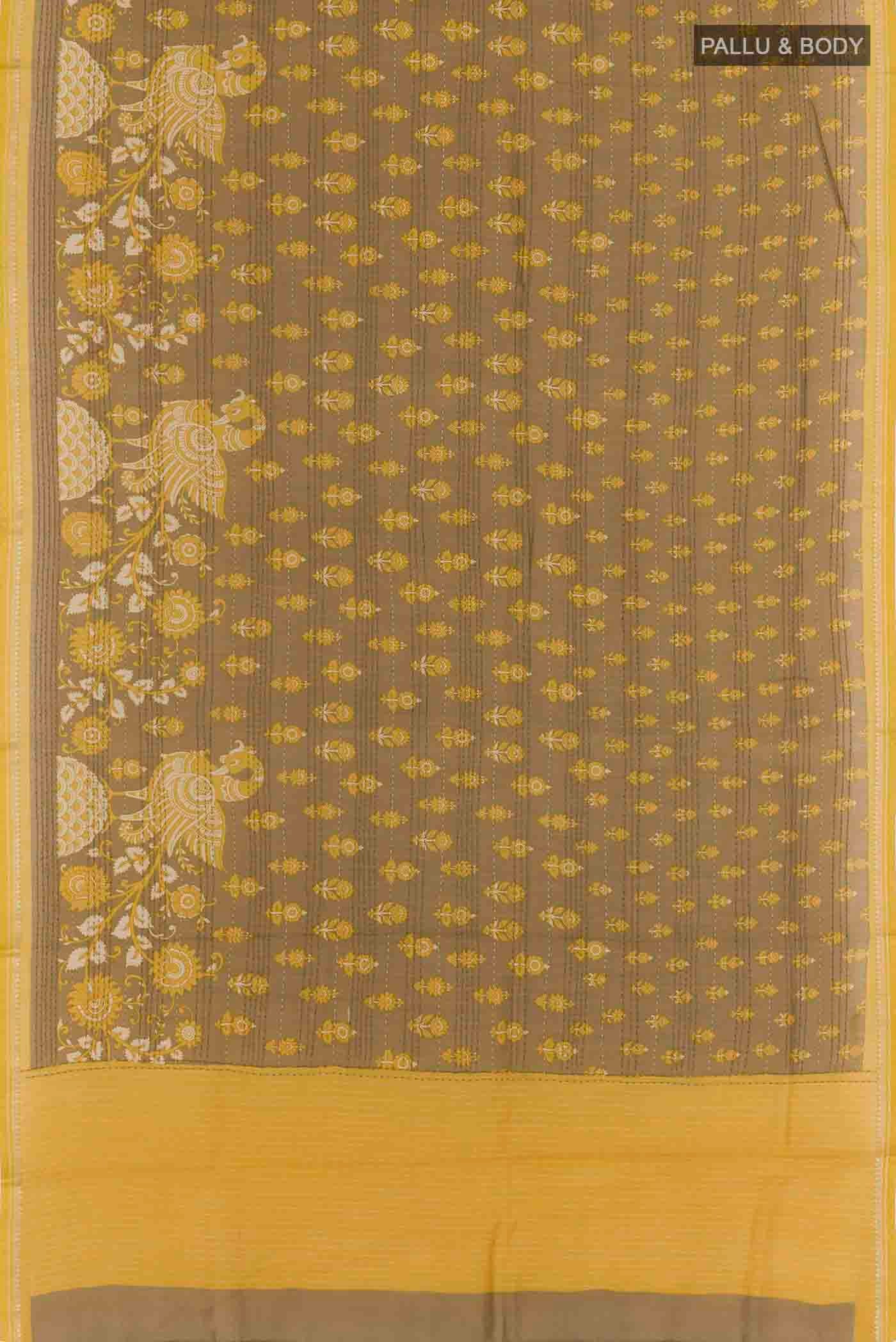 Flat view of Beige Tussar Saree with Printed design on the body and Zari Border