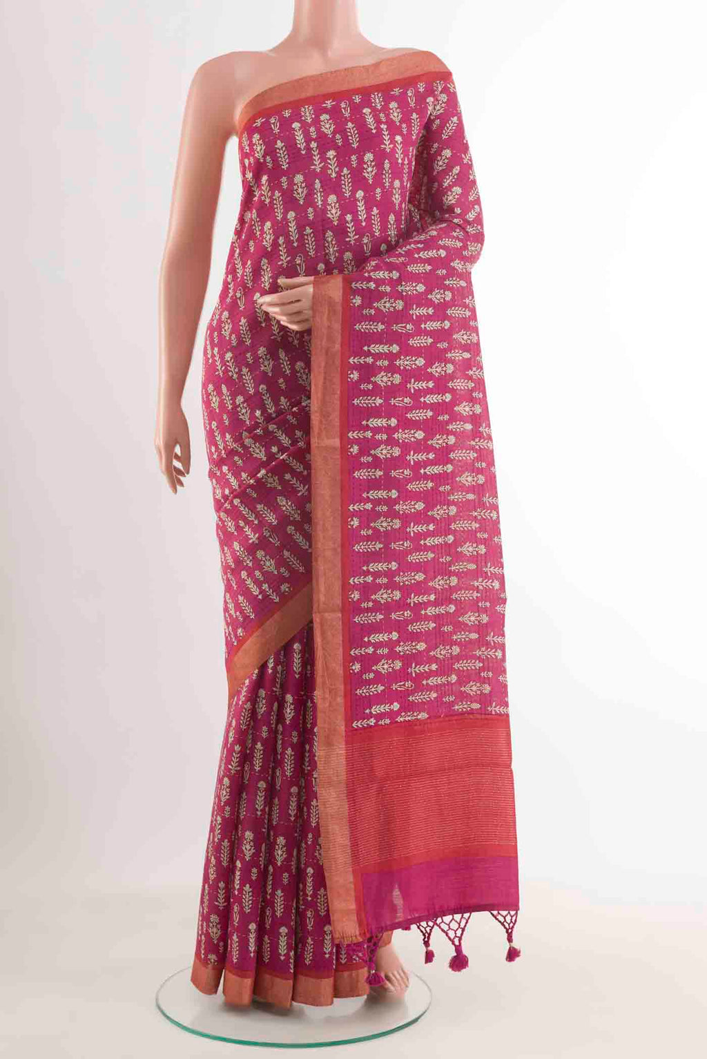 Pink Tussar Silk Saree with Printed design on the body and Zari Border displayed on a mannequin