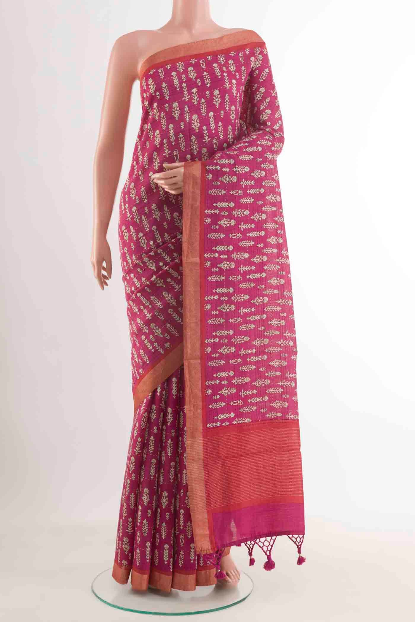 Pink Tussar Silk Saree with Printed design on the body and Zari Border displayed on a mannequin
