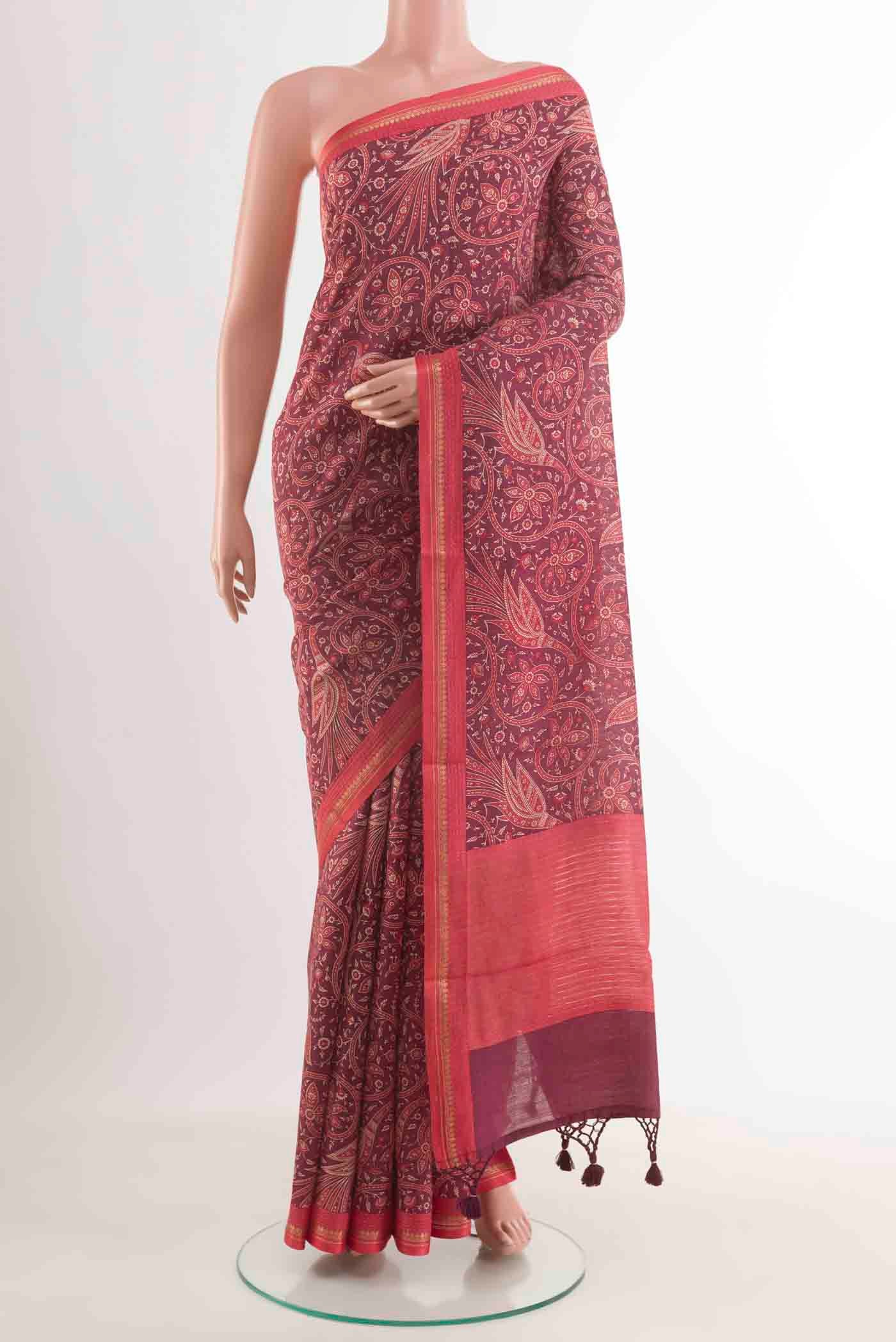 Purple Tussar Silk Saree with Printed design on the body and Zari Border displayed on a mannequin