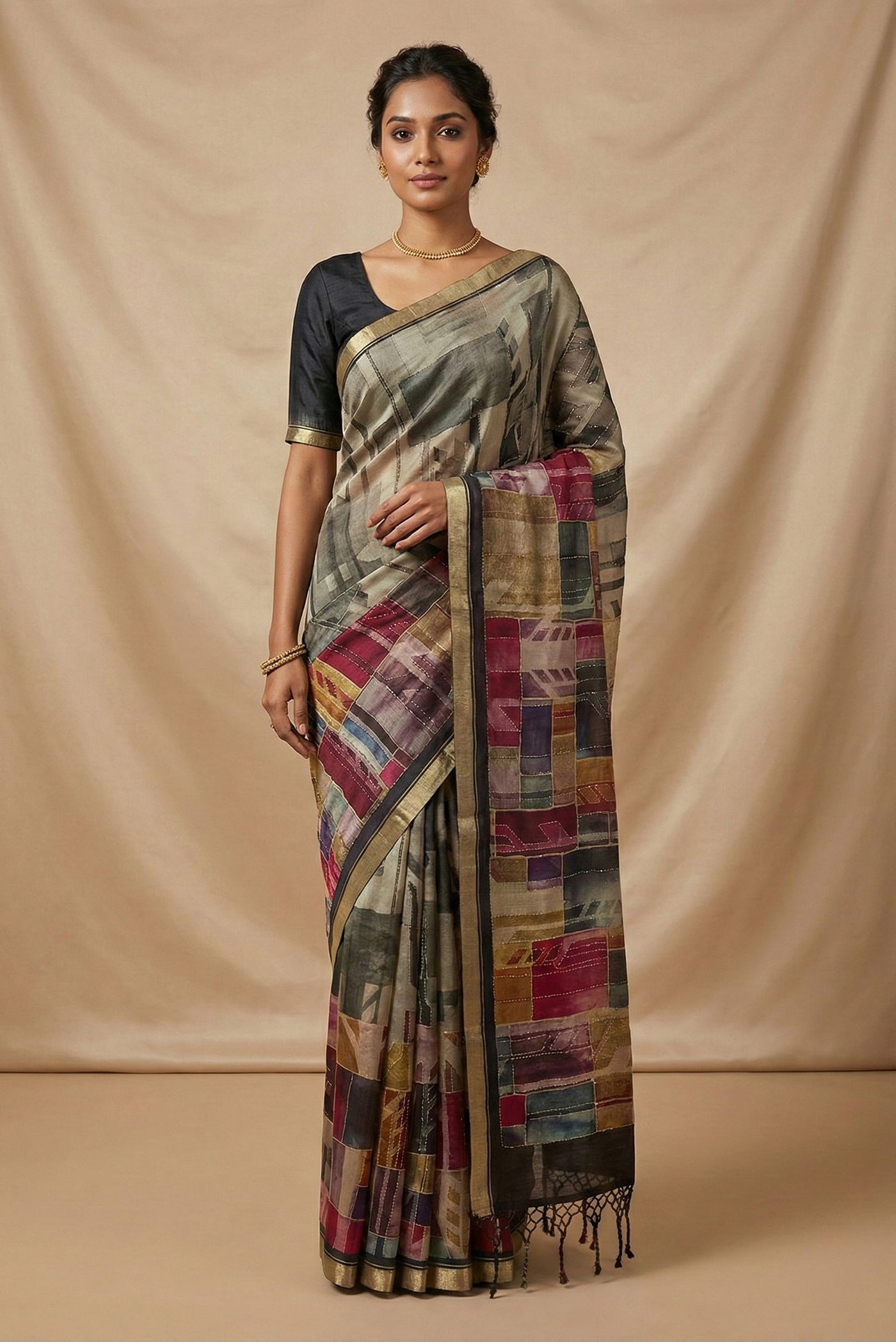 Model wearing a Grey Tussar Silk Saree with Printed design on the body and Zari Border.