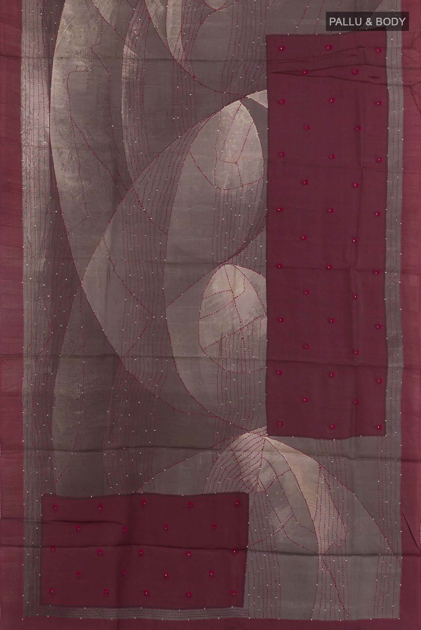 Flat view of Grey Tussar Saree with Printed design on the body and Zari Border. 