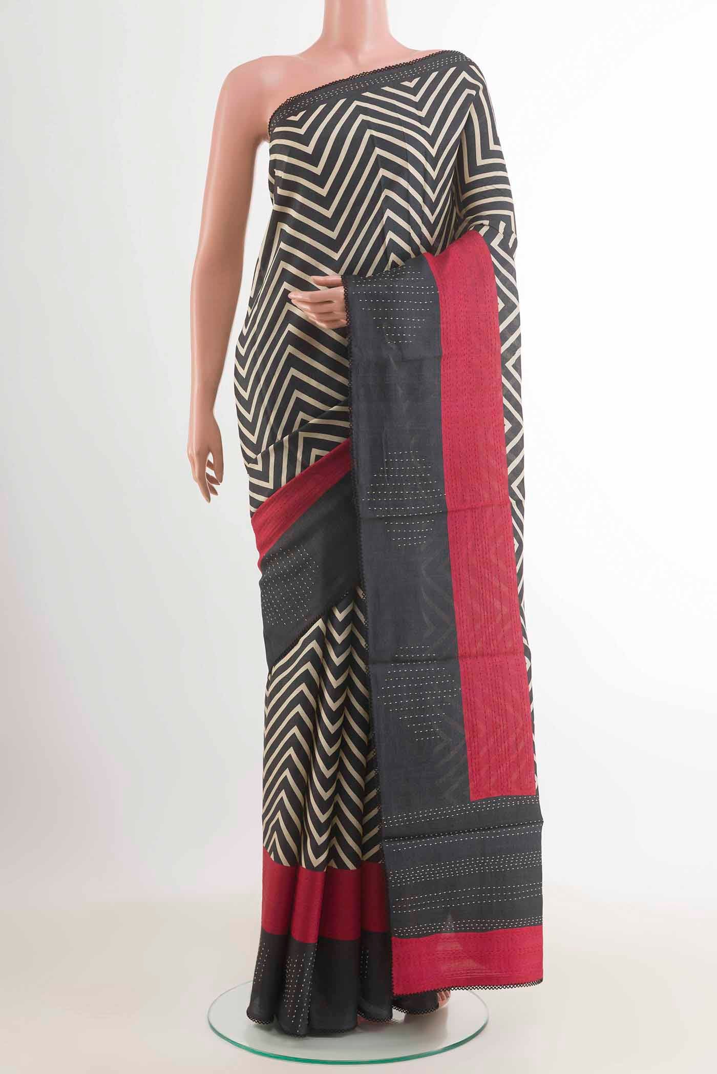 Dark Blue Tussar Saree with Printed design on the body and Plain Border displayed on a mannequin
