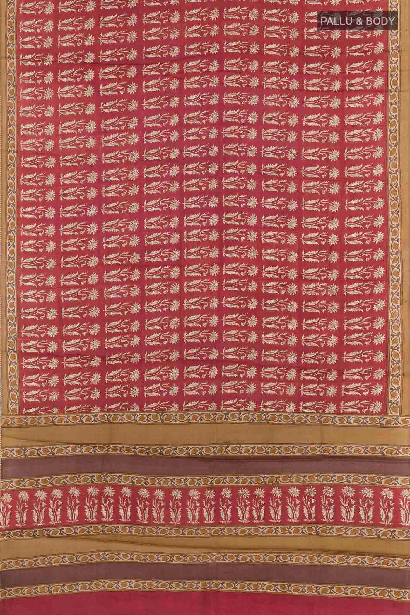 Flat view of Red Tussar Saree with Printed design on the body and Printed Border. 