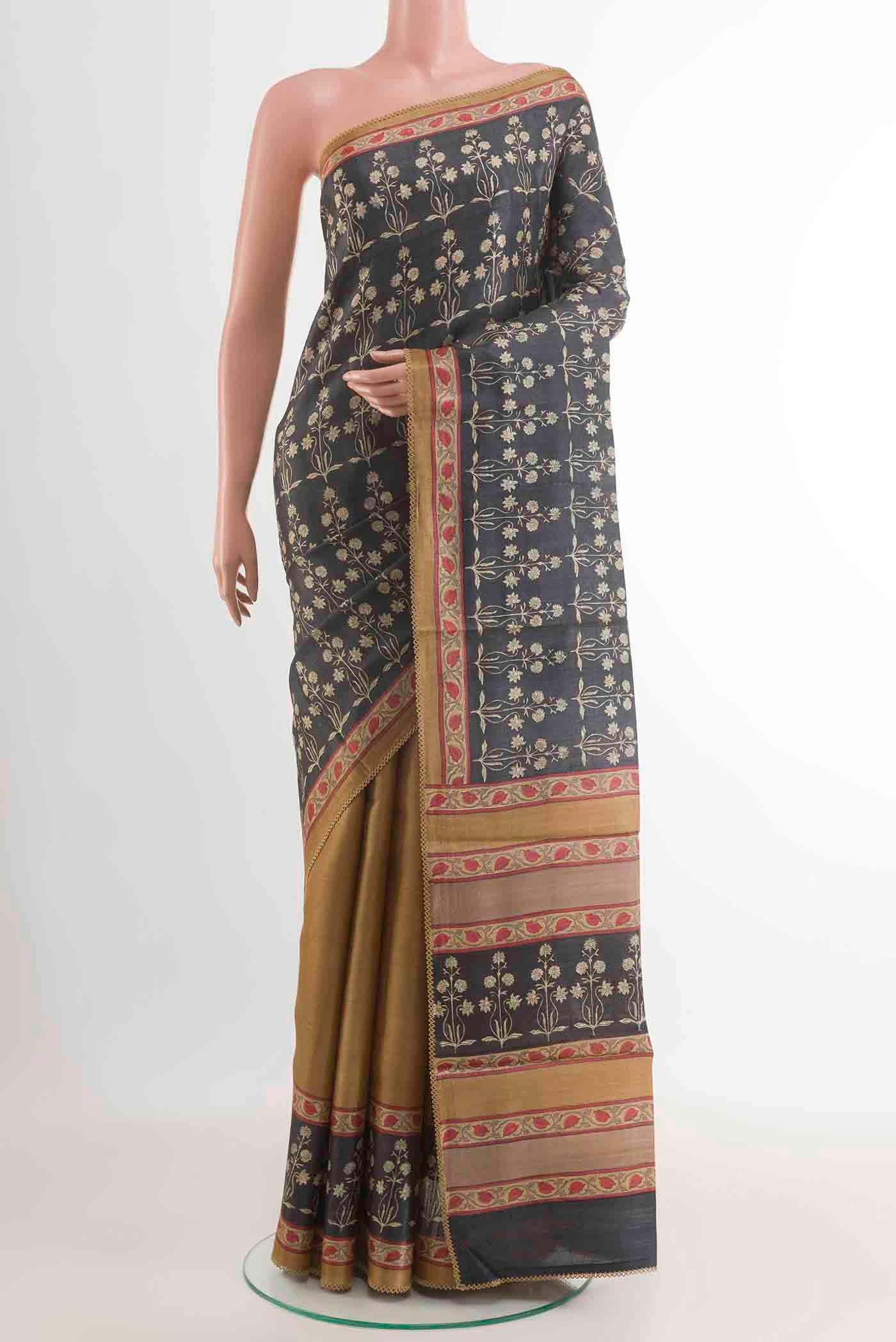 Dark Blue Tussar Saree with Printed design on the body and Printed Border displayed on a mannequin