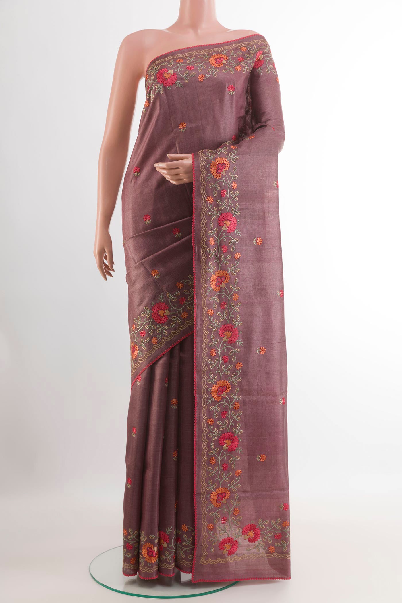 Light Magenta Tussar Saree with Thread Butta on the body and Embroidery Border.  displayed on a mannequin